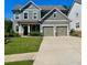 Charming two-story home with a two-car garage and well-manicured front lawn at 2431 Kingston Heath Way, Marietta, GA 30008