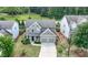 Charming home with a two-car garage, well-manicured lawn, and beautiful landscaping at 2431 Kingston Heath Way, Marietta, GA 30008