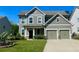 Charming two-story home with a well-manicured lawn and a two-car garage at 2431 Kingston Heath Way, Marietta, GA 30008
