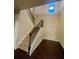 Inviting foyer with staircase, hardwood floors, and natural light from upper window at 2431 Kingston Heath Way, Marietta, GA 30008