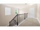 Upstairs hallway with carpet and a dark wood handrail at 2431 Kingston Heath Way, Marietta, GA 30008