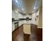 Bright kitchen featuring white cabinets, a granite island, and stainless steel appliances at 2431 Kingston Heath Way, Marietta, GA 30008