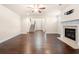 Inviting living room with fireplace, hardwood floors, and staircase access at 2431 Kingston Heath Way, Marietta, GA 30008