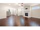 Spacious living room featuring hardwood floors and a cozy fireplace at 2431 Kingston Heath Way, Marietta, GA 30008