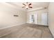 Generously sized primary bedroom with tray ceiling and doorway to a bath at 2431 Kingston Heath Way, Marietta, GA 30008