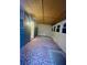 Enclosed sunroom with many windows and patterned floor covering at 2431 Kingston Heath Way, Marietta, GA 30008