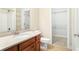 Inviting bathroom features granite counters, wood cabinets, and walk-in closet at 3512 Centerville Rosebud Rd, Snellville, GA 30039