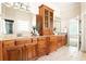 Bathroom with double vanity, granite countertops and wood cabinets at 3512 Centerville Rosebud Rd, Snellville, GA 30039