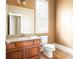 Neutral bathroom featuring a wooden vanity with a granite top and tile flooring at 3512 Centerville Rosebud Rd, Snellville, GA 30039