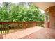 Spacious wooden deck overlooking a lush, green backyard with mature trees at 3512 Centerville Rosebud Rd, Snellville, GA 30039