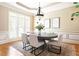 Elegant dining room featuring a large table, wainscoting, and ample natural light at 3512 Centerville Rosebud Rd, Snellville, GA 30039