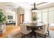 Bright dining room with a large table, tray ceiling, and view into the living room at 3512 Centerville Rosebud Rd, Snellville, GA 30039