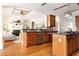An open concept kitchen with a view of the living room and a center island at 3512 Centerville Rosebud Rd, Snellville, GA 30039