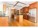 Open kitchen with wood cabinets, center island, and stainless steel appliances at 3512 Centerville Rosebud Rd, Snellville, GA 30039