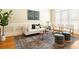 Cozy living room showcasing modern decor, neutral tones, and a decorative area rug at 3512 Centerville Rosebud Rd, Snellville, GA 30039
