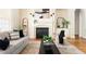 Living room featuring a fireplace and neutral colored furniture at 3512 Centerville Rosebud Rd, Snellville, GA 30039