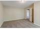 Bedroom with neutral colored walls and carpet at 545 Fayetteville Rd, Fairburn, GA 30213