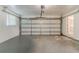 Spacious garage with an automatic door opener, room for storage and a window for natural light at 545 Fayetteville Rd, Fairburn, GA 30213