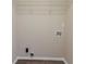 Walk-in closet featuring a wire shelf and vinyl floors at 545 Fayetteville Rd, Fairburn, GA 30213
