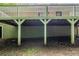 View under the deck of the home, revealing supporting beams and open space to the home's foundation at 733 San Fernando Se Dr, Smyrna, GA 30080