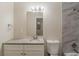 Stylish bathroom with modern fixtures, granite vanity, marble tile, and plenty of natural light at 733 San Fernando Se Dr, Smyrna, GA 30080