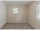Neutral bedroom featuring gray carpet, closet and natural light from the window at 733 San Fernando Se Dr, Smyrna, GA 30080