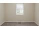 Cozy bedroom featuring plush carpeting, neutral paint, and a sunny window, perfect for relaxation at 733 San Fernando Se Dr, Smyrna, GA 30080