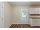 Bright dining area with vinyl plank floors, a back door, and easy access to the kitchen at 733 San Fernando Se Dr, Smyrna, GA 30080