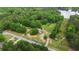 Bird's eye view of property featuring lush greenery, peaceful lake, and surrounding wooded areas at 901 N Van Wert Rd, Villa Rica, GA 30180