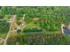 Aerial view of property showing mature trees, distinct boundaries, and proximity to a tranquil lake at 901 N Van Wert Rd, Villa Rica, GA 30180