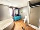 Bathroom featuring a soaking tub, walk-in shower, and a stylish vanity at 901 N Van Wert Rd, Villa Rica, GA 30180