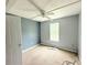 Bedroom featuring neutral walls, a ceiling fan, and a window providing natural light at 901 N Van Wert Rd, Villa Rica, GA 30180