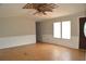 Bright living room with hardwood floors, ceiling fan, and neutral paint tones at 901 N Van Wert Rd, Villa Rica, GA 30180