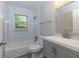 Bathroom featuring modern subway tile, a gray vanity, and combined tub and shower at 2917 Reveille Se Cir, Atlanta, GA 30316