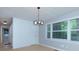 Bright dining room featuring a modern light fixture, natural light, and shiplap accent wall at 2917 Reveille Se Cir, Atlanta, GA 30316