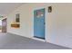 Close up of light blue front door with glass inset, white brick, and flower box at 2917 Reveille Se Cir, Atlanta, GA 30316