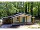 Quaint bungalow features a blue front door and a charming front porch at 2917 Reveille Se Cir, Atlanta, GA 30316