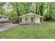 Quaint bungalow features a blue front door and a charming front porch at 2917 Reveille Se Cir, Atlanta, GA 30316