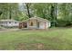 Charming single-story home with a covered porch and well-maintained lawn surrounded by mature trees at 2917 Reveille Se Cir, Atlanta, GA 30316