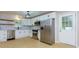Bright kitchen with stainless steel appliances, subway tile backsplash, and floating shelves at 2917 Reveille Se Cir, Atlanta, GA 30316