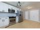 Bright kitchen features white cabinets, stainless steel appliances, and herringbone backsplash at 2917 Reveille Se Cir, Atlanta, GA 30316