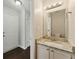 Well-lit half bathroom with granite countertop and modern fixtures at 3570 Steve Nw Dr, Marietta, GA 30064