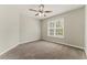 Cozy bedroom with stylish ceiling fan and ample natural light streaming through the windows at 3570 Steve Nw Dr, Marietta, GA 30064