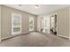 Bright living room featuring neutral paint, large windows, and plush carpet at 3570 Steve Nw Dr, Marietta, GA 30064