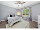 Serene bedroom with natural light, featuring a comfortable bed and neutral decor at 3707 Lance Bluff Ln, Duluth, GA 30097