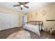 Bright bedroom featuring neutral colors, hardwood flooring, and a comfortable bed at 3707 Lance Bluff Ln, Duluth, GA 30097