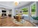 Bright breakfast nook with a round table and a view of the outdoor pool at 3707 Lance Bluff Ln, Duluth, GA 30097
