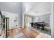 Bright foyer with wood floors leading to a dining area and a white front door at 3707 Lance Bluff Ln, Duluth, GA 30097