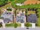 Aerial shot capturing a luxurious backyard oasis, complete with a pool, hot tub, and outdoor seating area at 5068 Bentwater Sw Ln, Lilburn, GA 30047