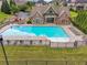 Aerial view of the community pool, pool house, and playground at 5068 Bentwater Sw Ln, Lilburn, GA 30047